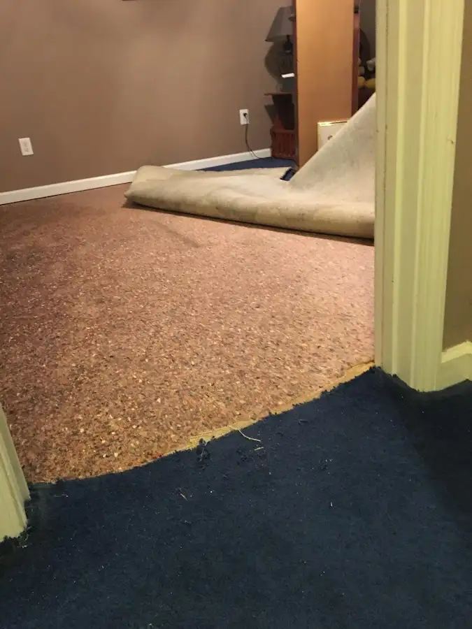 Carpet pad removal revealing water damage during Water Mitigation Services in Sedona