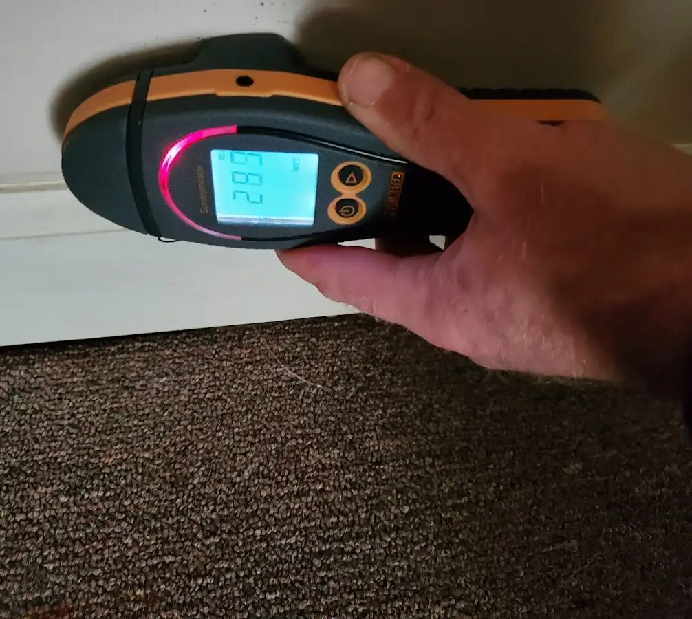 Moisture detection at baseboard during Storm Damage Restoration in Sedona